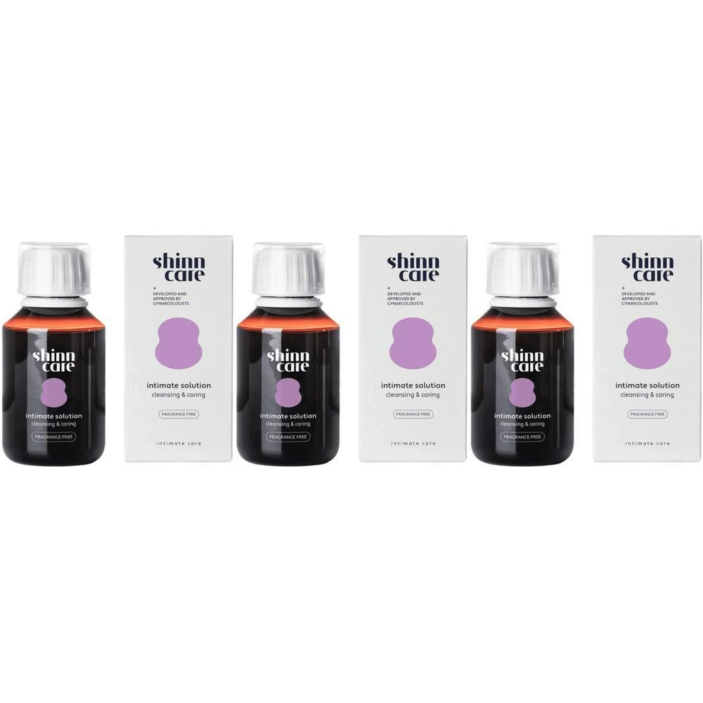 Plusieurs flacons et emballages de SHINN CARE Intimate Solution. Flacons avec bouchon blanc, étiquette noire et texte.