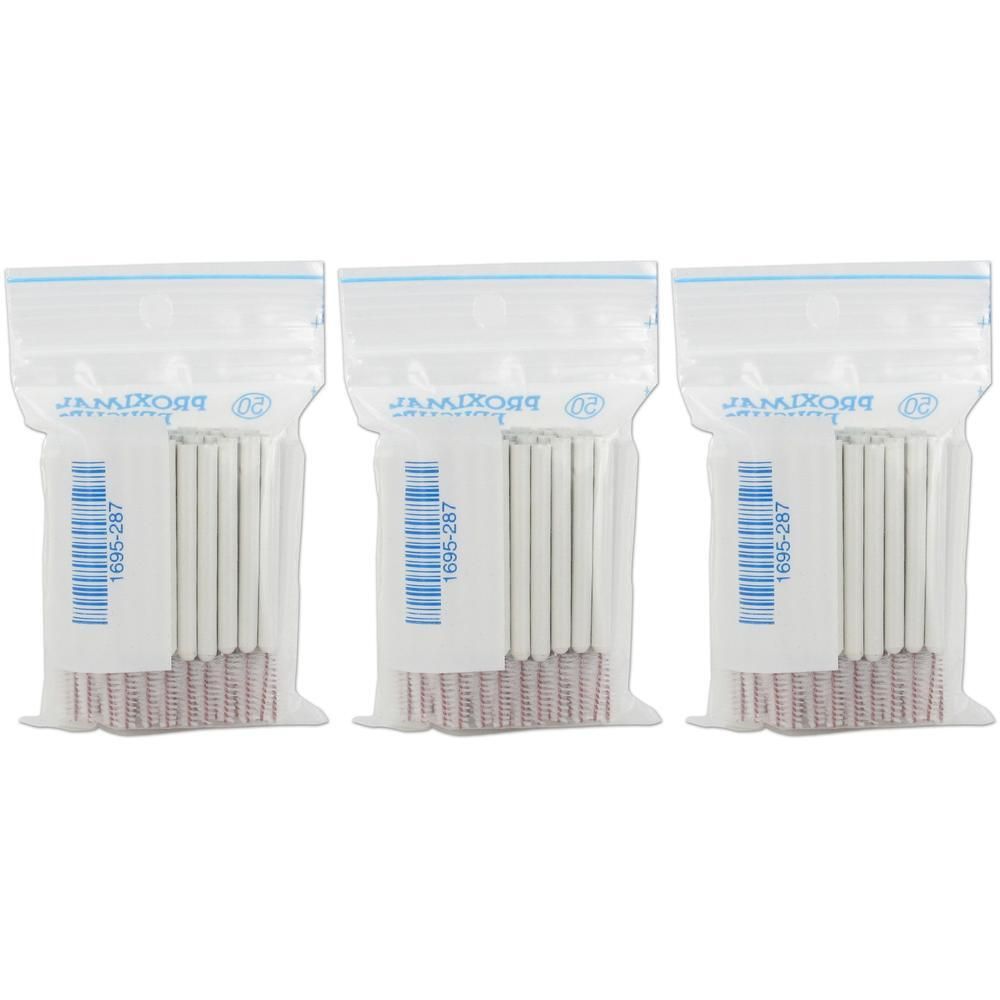 Trois sachets transparents contenant des brosses cylindriques blanches. Des codes-barres et du texte sont visibles sur les sachets.