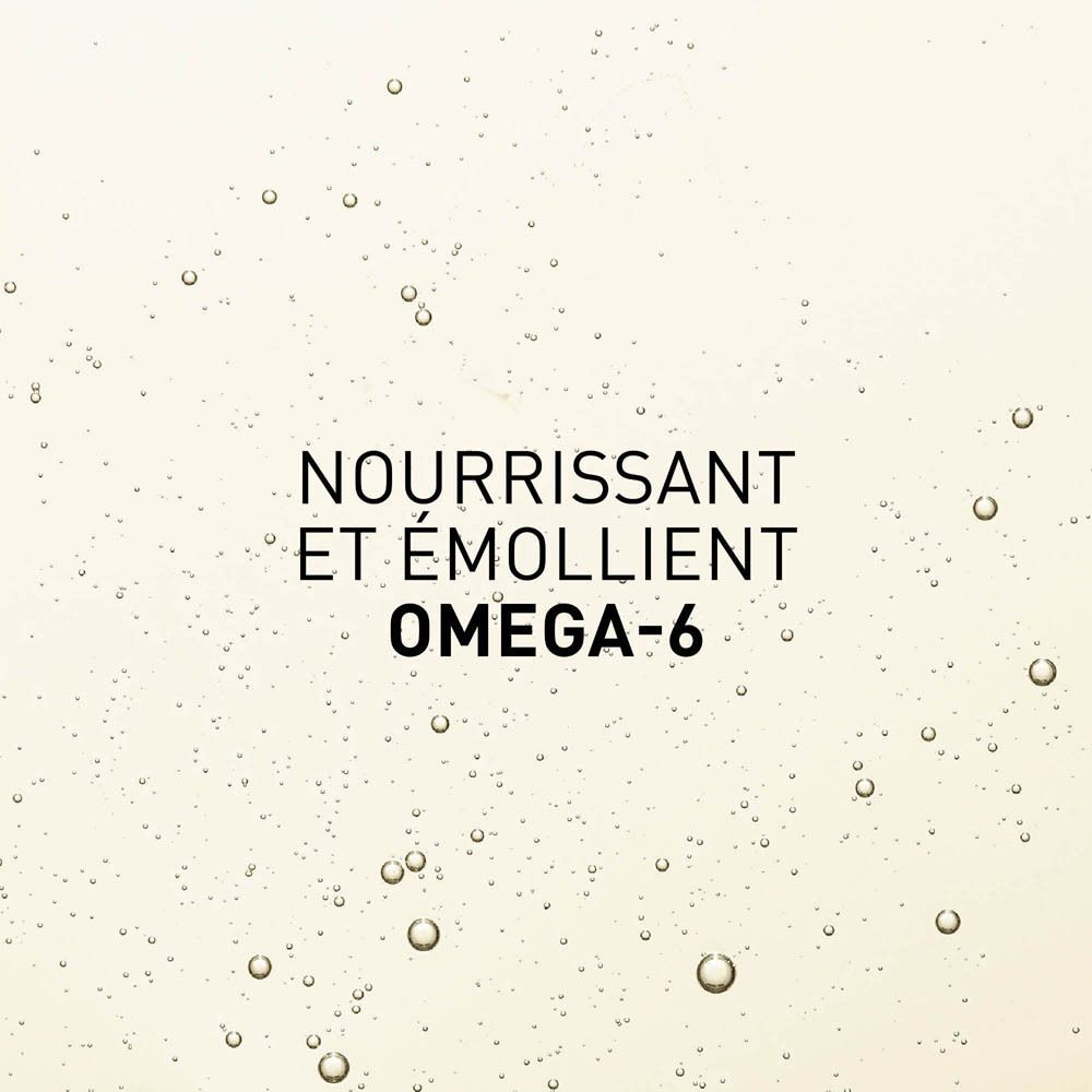 Gros plan de liquide avec texte: NOURRISSANT ET ÉMOLLIENT OMEGA-6.