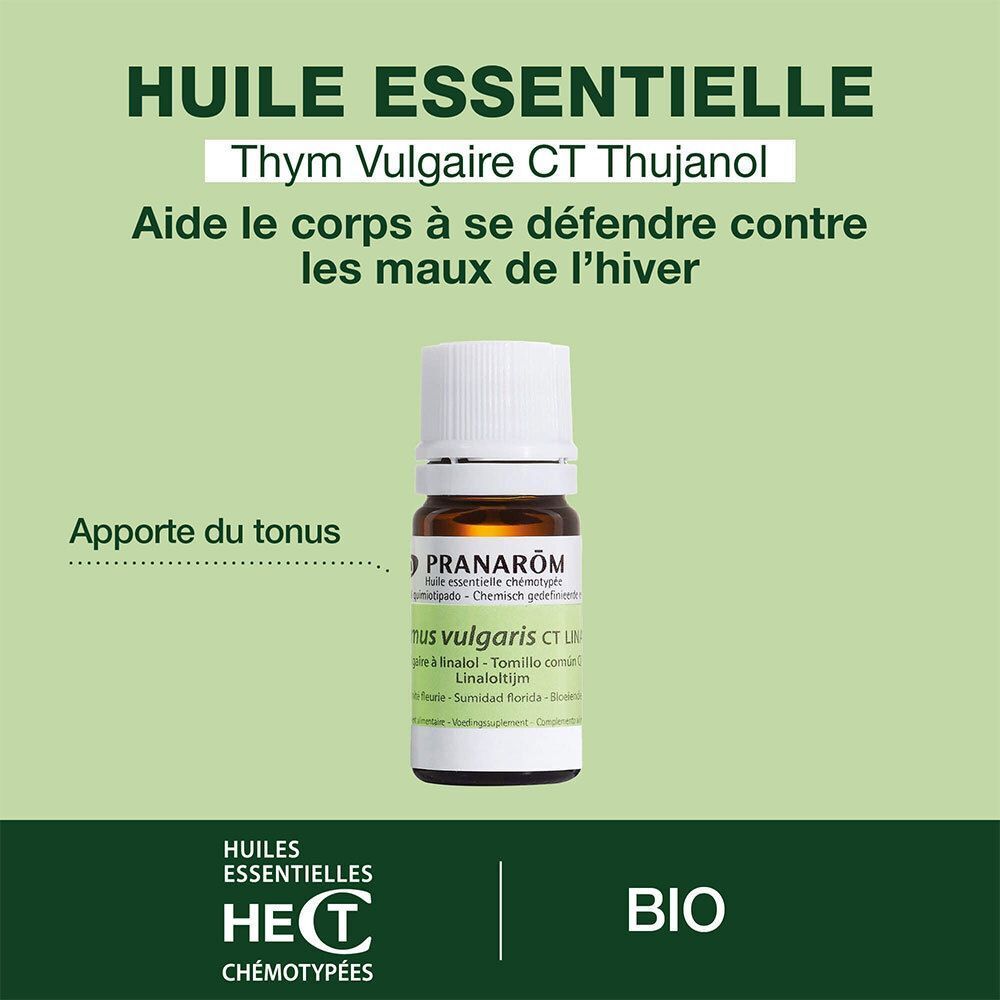 Flacon d'huile essentielle de thym. Marque Pranarôm. Étiquettes vertes, bouchon blanc. Texte : Huile Essentielle, BIO.