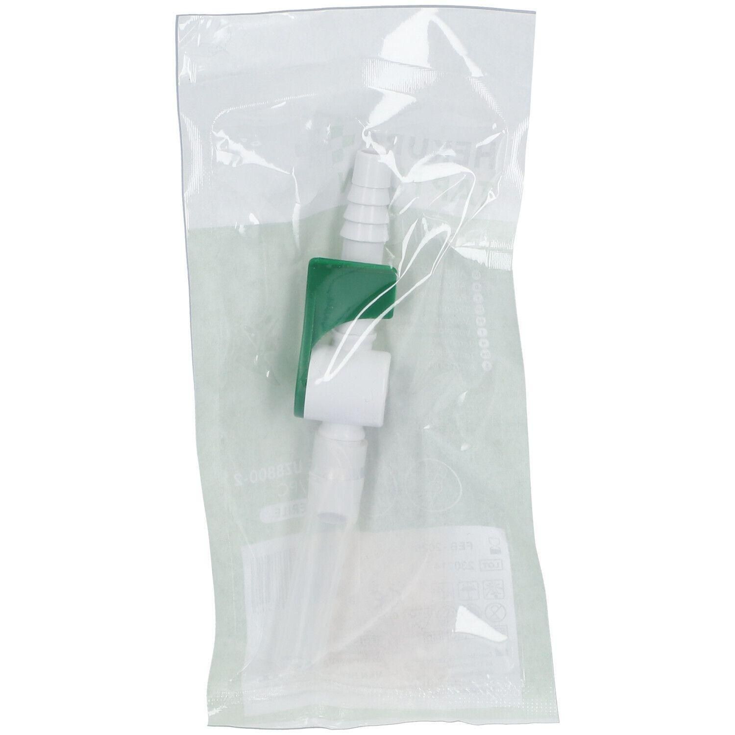Robinet de vidange à levier stérile, emballé. Plastique blanc et vert, tubes transparents. Conditionnement transparent.