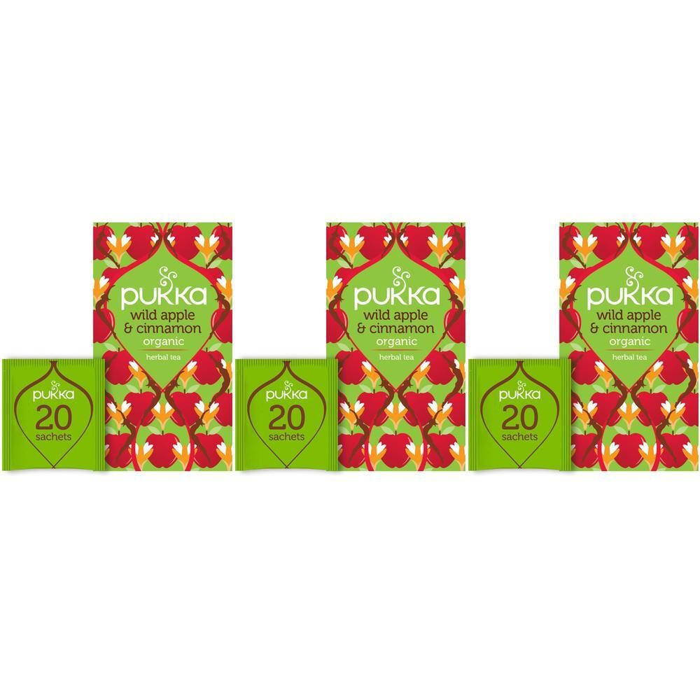 Trois boîtes de sachets de thé. Sur les emballages, on peut lire "Pukka wild apple & cinnamon organic". Chaque boîte contient 20 sachets.