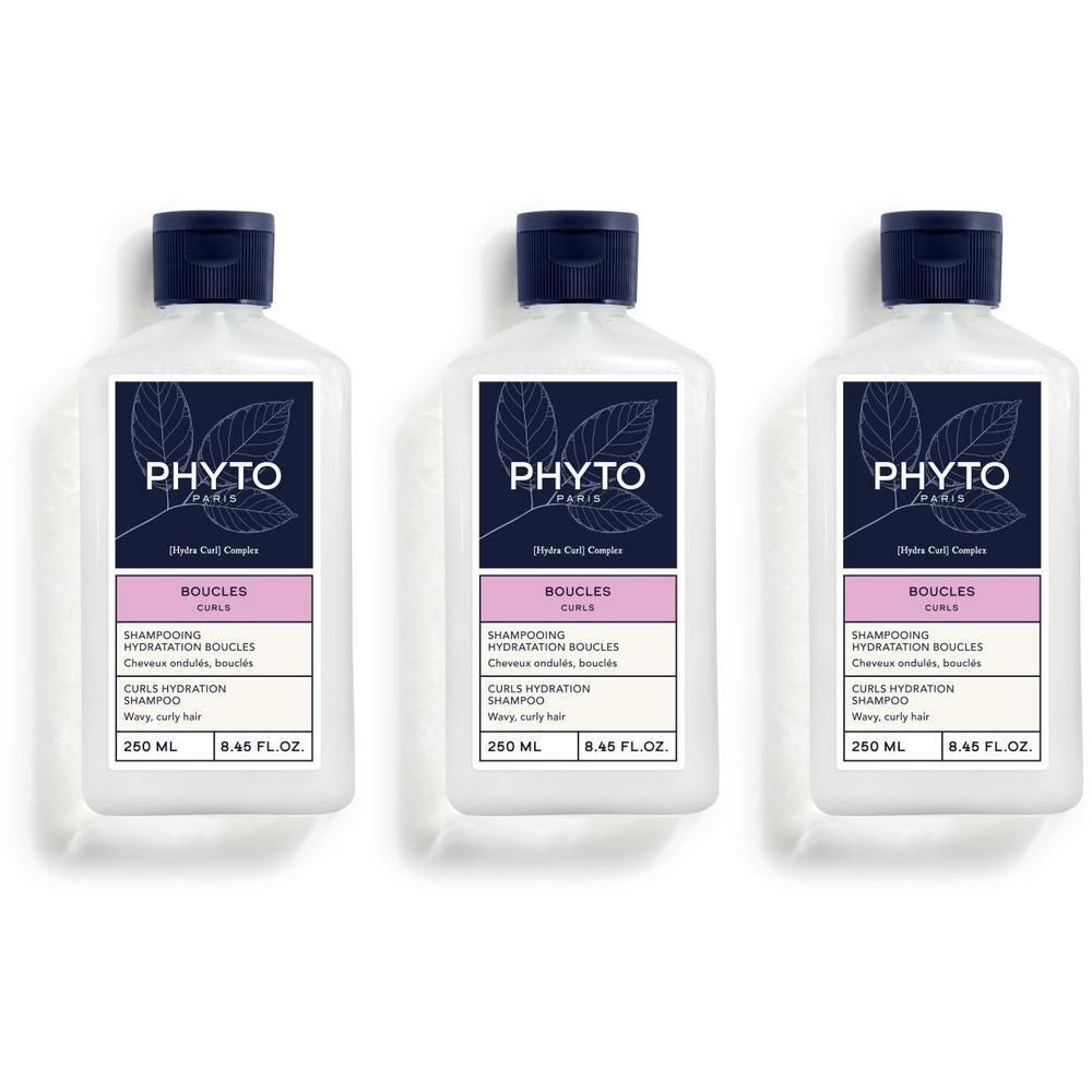 Drie witte flessen met blauwe dop. Opschrift PHYTO, BOUCLES, Shampooing Hydratation Boucles. Voor krullend haar.