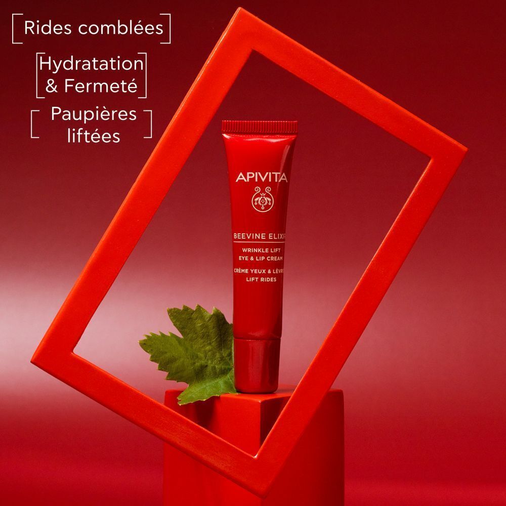 Tube rouge Apivita Beevine Elixir Crème Yeux & Lèvres Lift Rides dans un cadre rouge. Texte: Rides comblées.