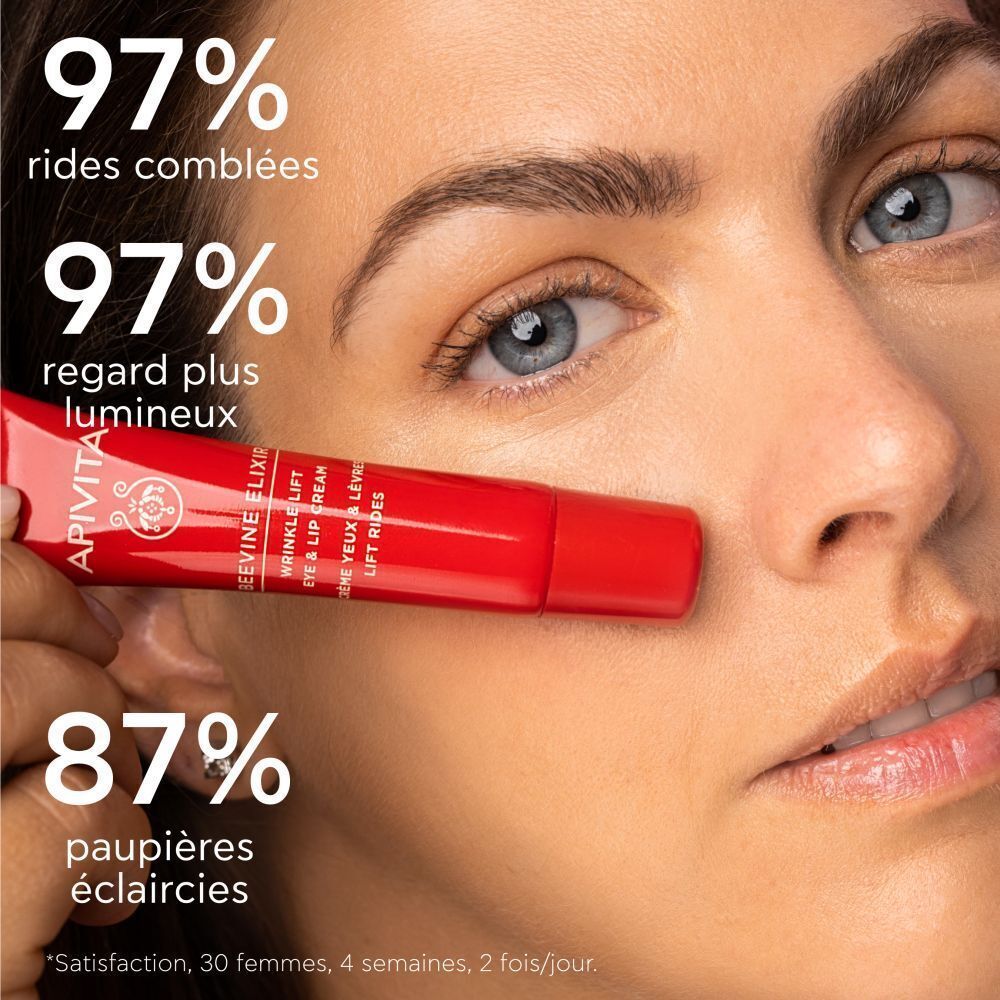 Femme avec tube Apivita Beevine Elixir Crème Yeux & Lèvres Lift Rides. Texte: 97% rides comblées.
