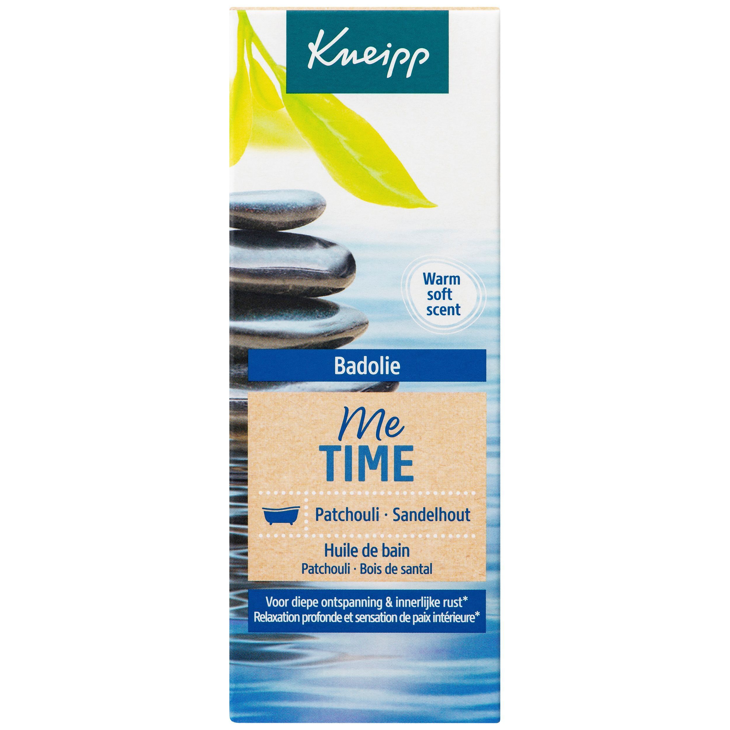 Kneipp Badolie "Me Time" fles en verpakking. Verpakking met productnaam, logo en afbeelding van stenen.