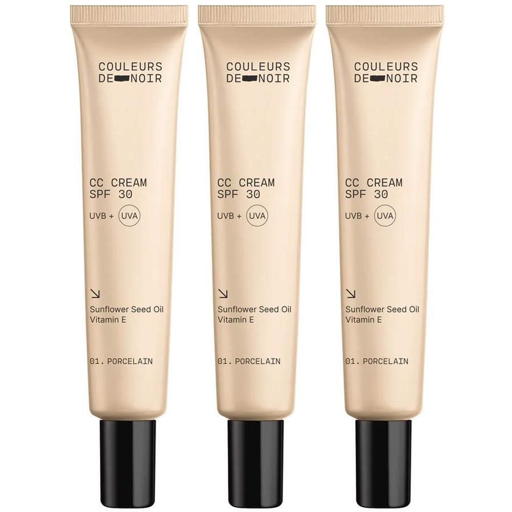 Drie tubes Couleurs de Noir CC CREAM SPF30 01 Porcelain. Beige tubes met zwarte dop. Tekst: CC CREAM SPF 30, UVB + UVA.