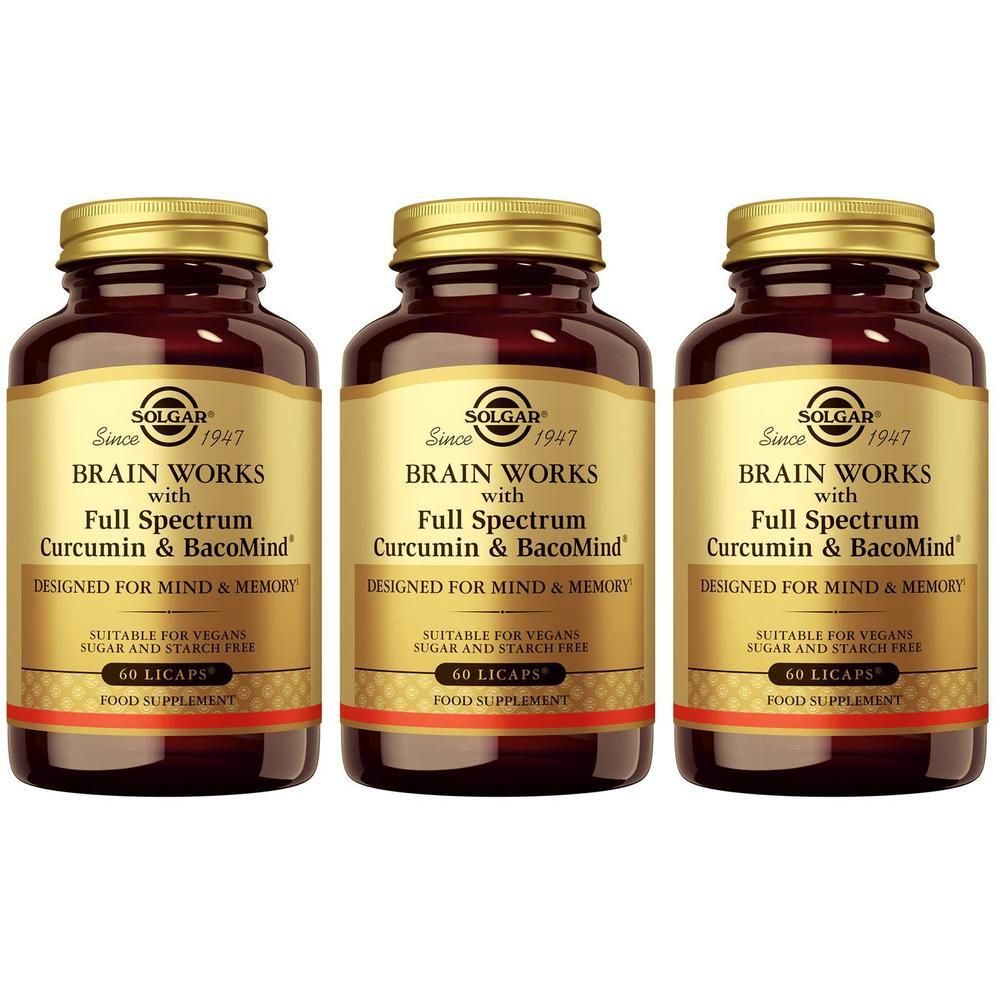 Trois flacons Solgar Brain Works. Bouchons dorés, flacons bruns, étiquettes dorées avec texte.