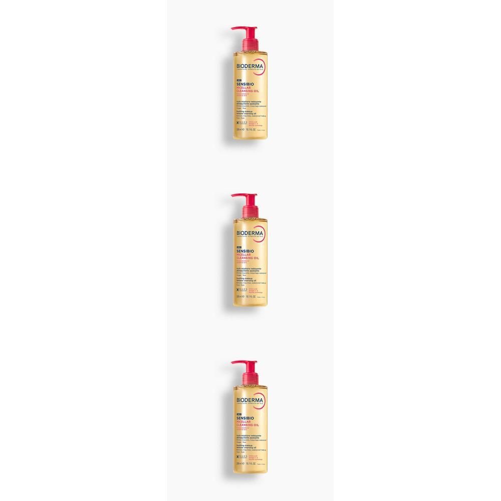 Trois flacons de Bioderma Sensibio Huile micellaire démaquillante, avec pompe rouge, sur fond blanc.