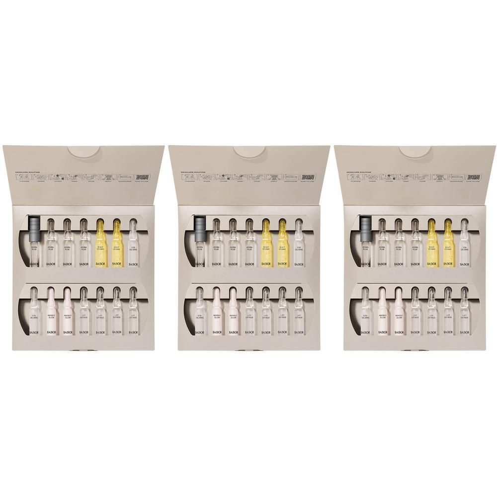 Trois boîtes ouvertes contenant des ampoules de sérum. Chaque boîte contient 14 ampoules de différentes couleurs.