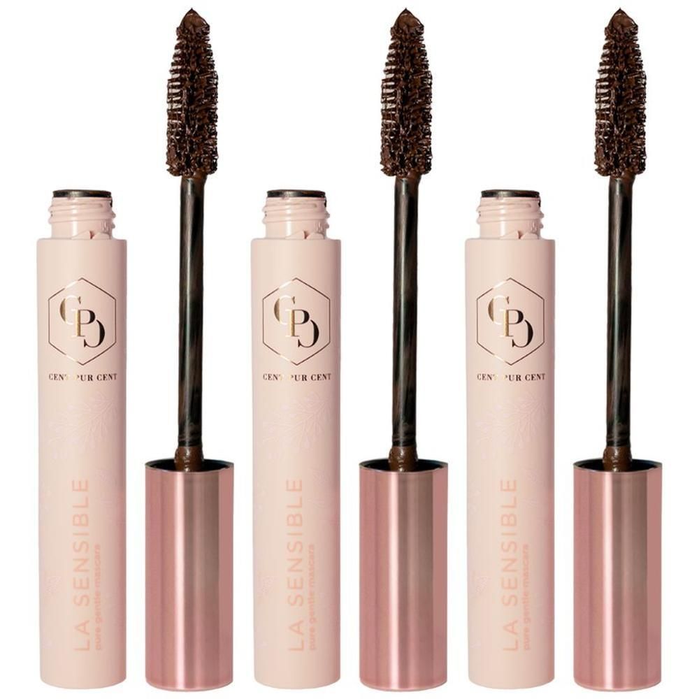 Trois mascaras, partiellement ouverts. Tubes rose doré avec brosses marron. Inscription: LA SENSIBLE, CENT PUR CENT.