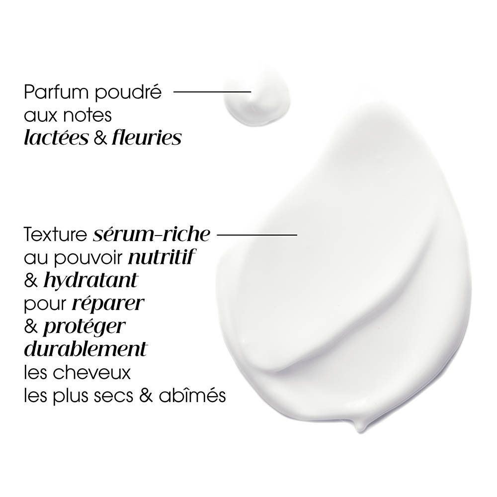 Texture crème blanche avec description du parfum et des propriétés nourrissantes pour cheveux secs et abîmés.
