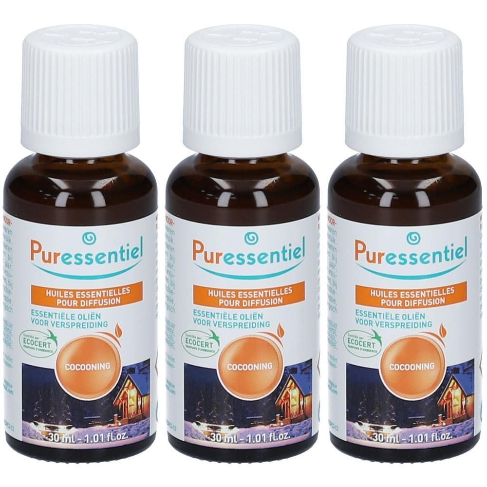 Drie bruine glazen flessen met witte doppen. Labels met "Puressentiel" en "Huiles essentielles pour diffusion".