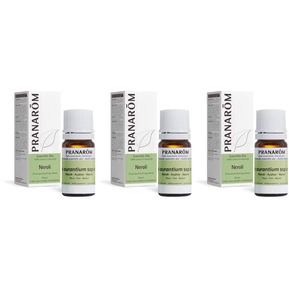 Drie flessen en verpakkingen van Pranarôm Huile Essentielle Neroli. Witte flessen met groene etiketten.