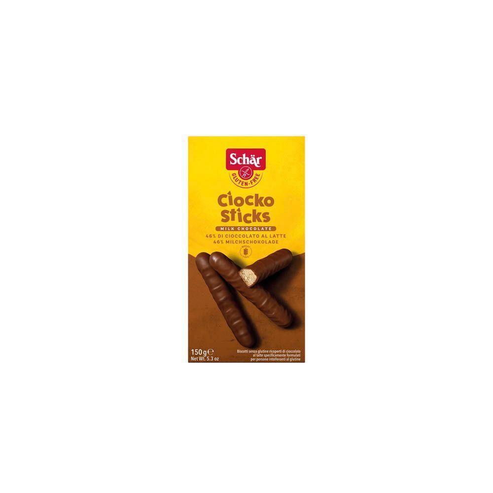 Boîte jaune Schär Ciocko Sticks. Label sans gluten. Trois barres chocolatées avec garniture claire devant l'emballage.