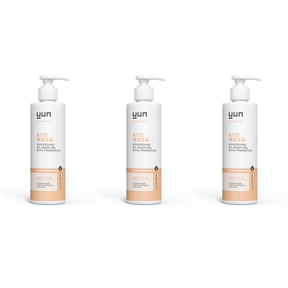 Trois flacons blancs avec pompe. Inscription : YUN ATO WASH, avec huile prébiotique. Étiquettes beiges et blanches.
