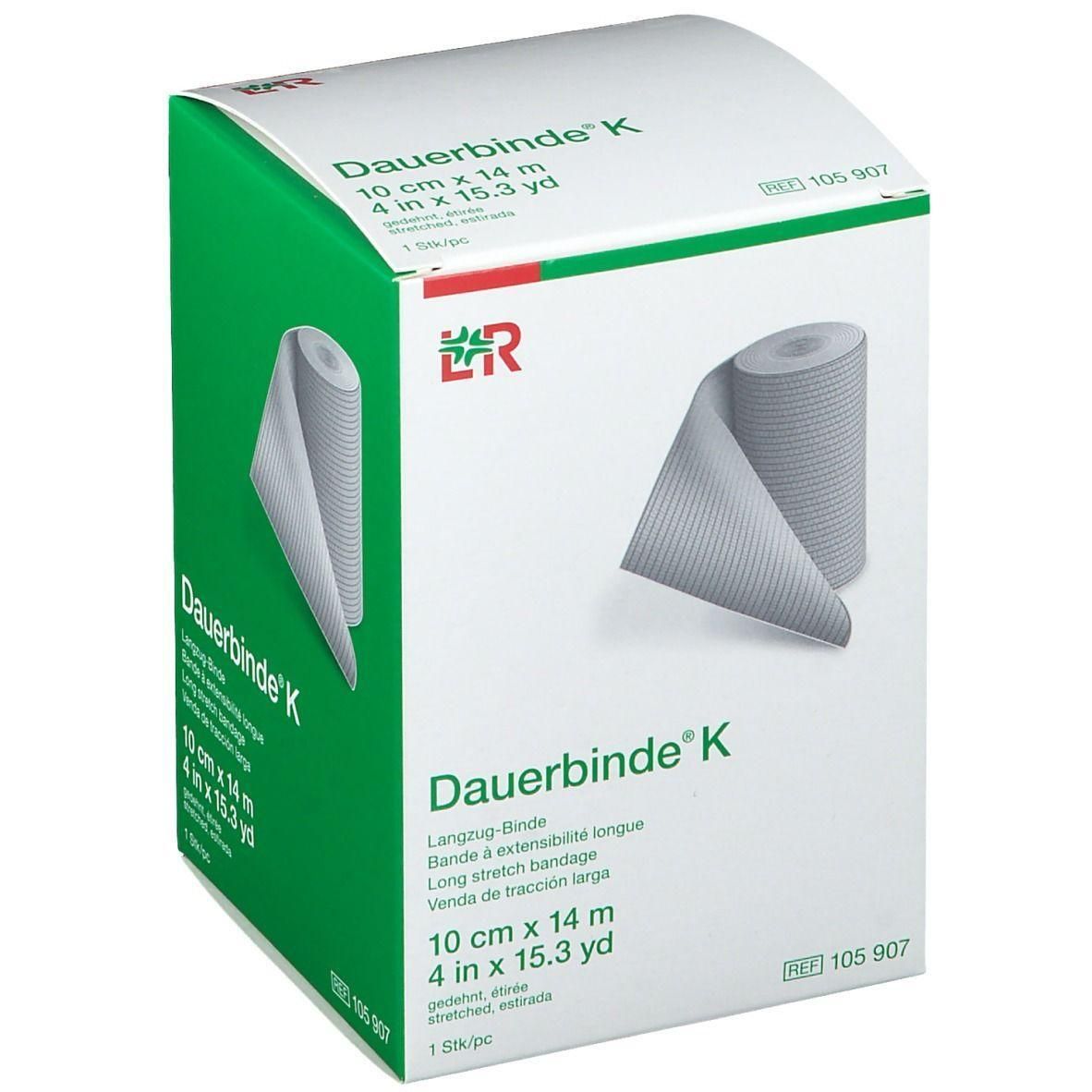 Boîte de Dauerbinde K. Inscription : 10 cm x 14 m, 4 in x 15.3 yd. Rouleau visible. Emballage vert et blanc avec logo.