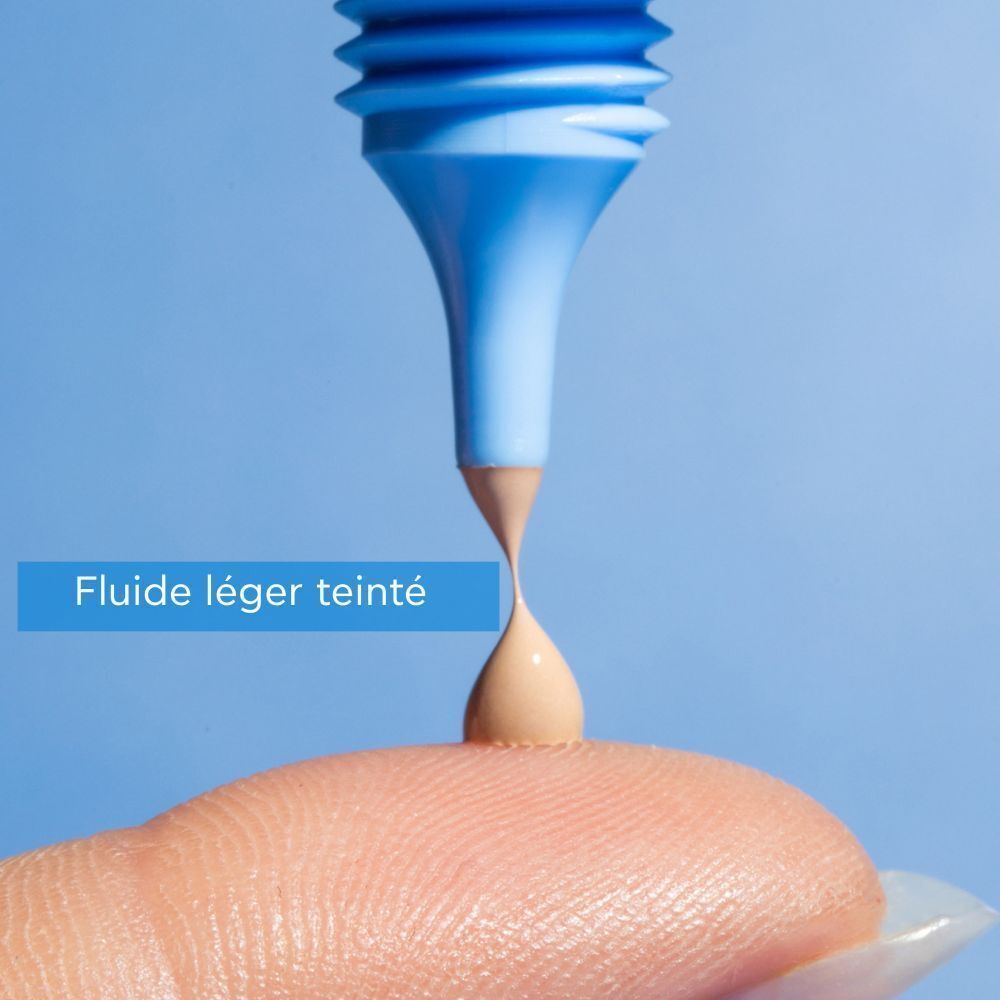 Produit pressé hors du tube. Inscription: Aqua Beelicious. Texte: Fluide léger teinté. Teinte.