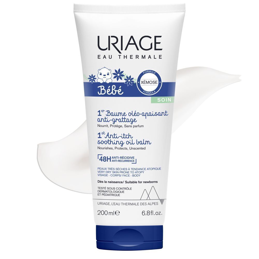 Tube Uriage Xémose Bébé 1er Baume Oléo-Apaisant Anti-Grattage. Wit, blauw. Product en crème textuur.