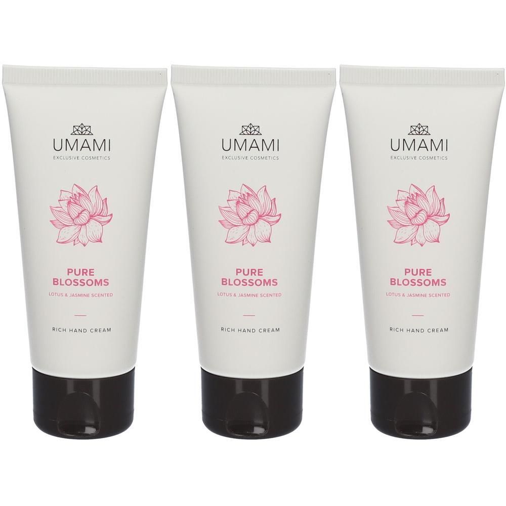 Drie tubes handcrème. Wit, met roze bloemmotief en zwarte dop. Tekst: UMAMI, Pure Blossoms, Rich Hand Cream.