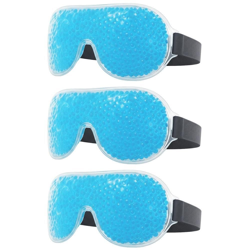 Drie blauwe oogmaskers met zwarte banden. De maskers zijn gevuld met kleine bolletjes.
