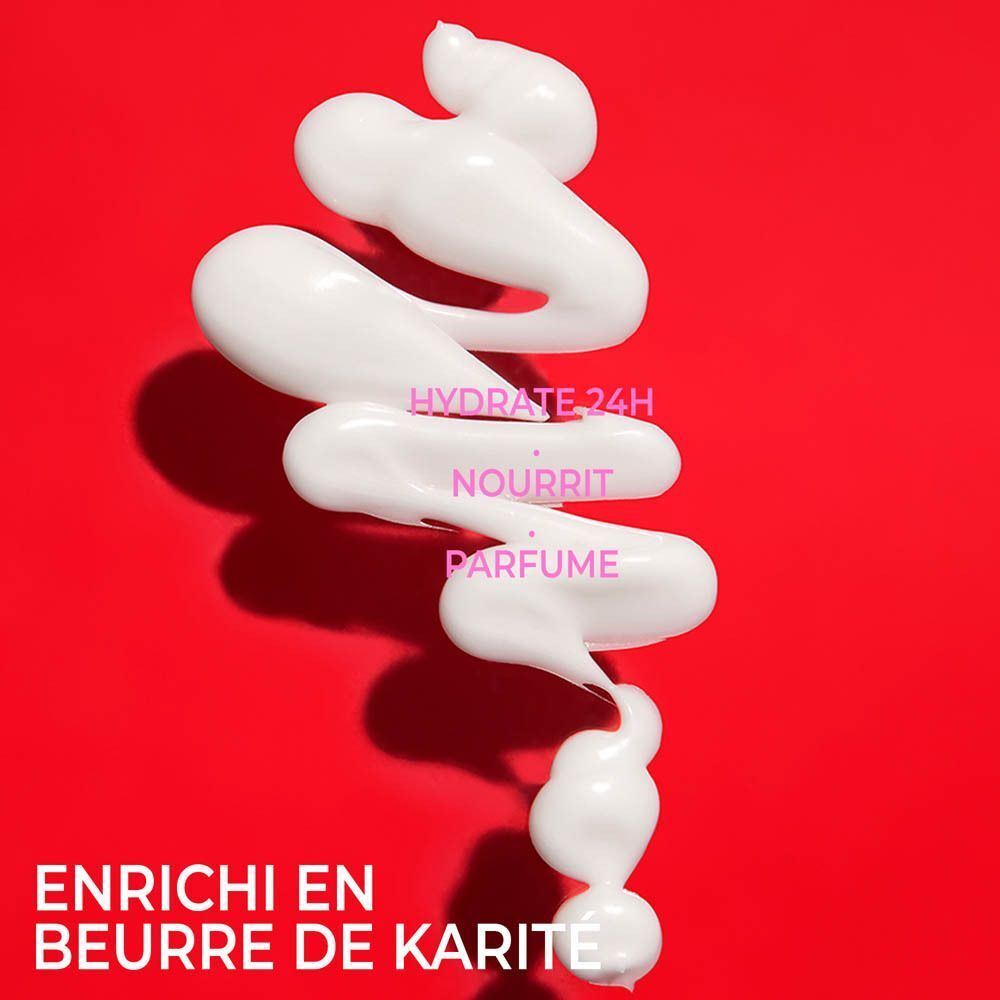 Produit blanc sur fond rouge. Texte : Hydrate 24H, Nourrit, Parfume, Enrichi en beurre de karité.