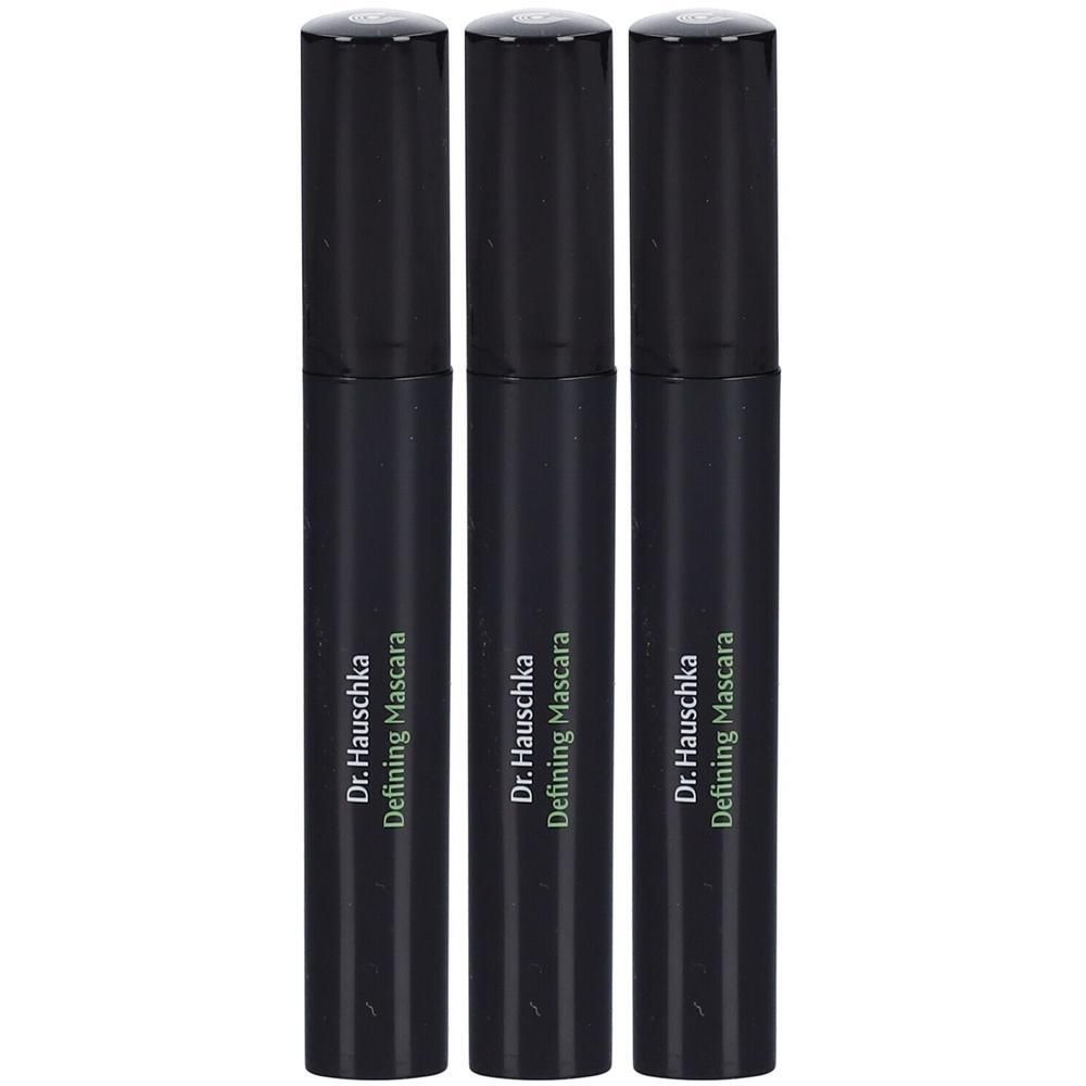 Drie zwarte mascaratubes. Op elke tube staat "Dr. Hauschka Defining Mascara".