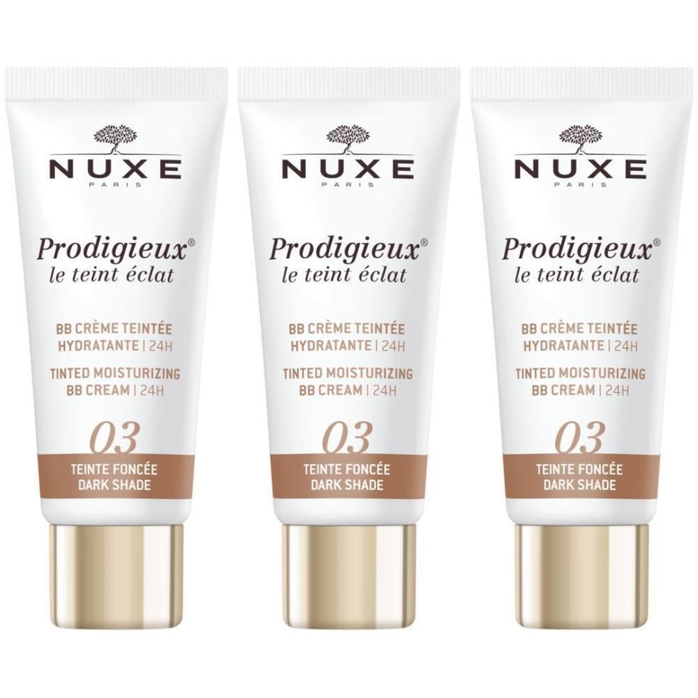 Drie tubes Nuxe Prodigieux BB Crème Teintée Hydratante 24h. Opschrift: 03 Teinte Foncée. Witte tubes met gouden basis.