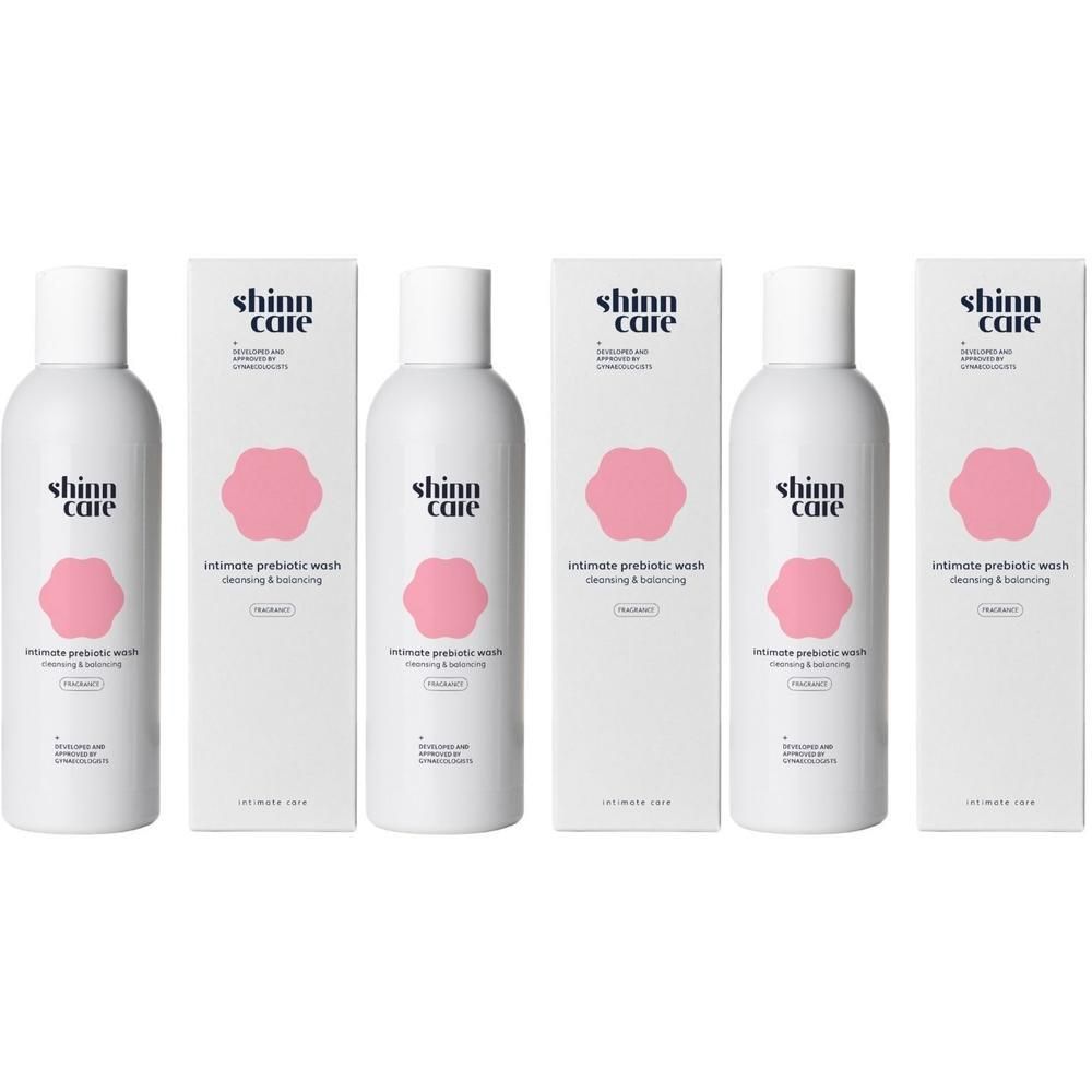 Plusieurs flacons et boîtes de Shinncare Lotion lavante prébiotique intime Cleansing & Balancing - Parfumé. Blanc, logo rose.