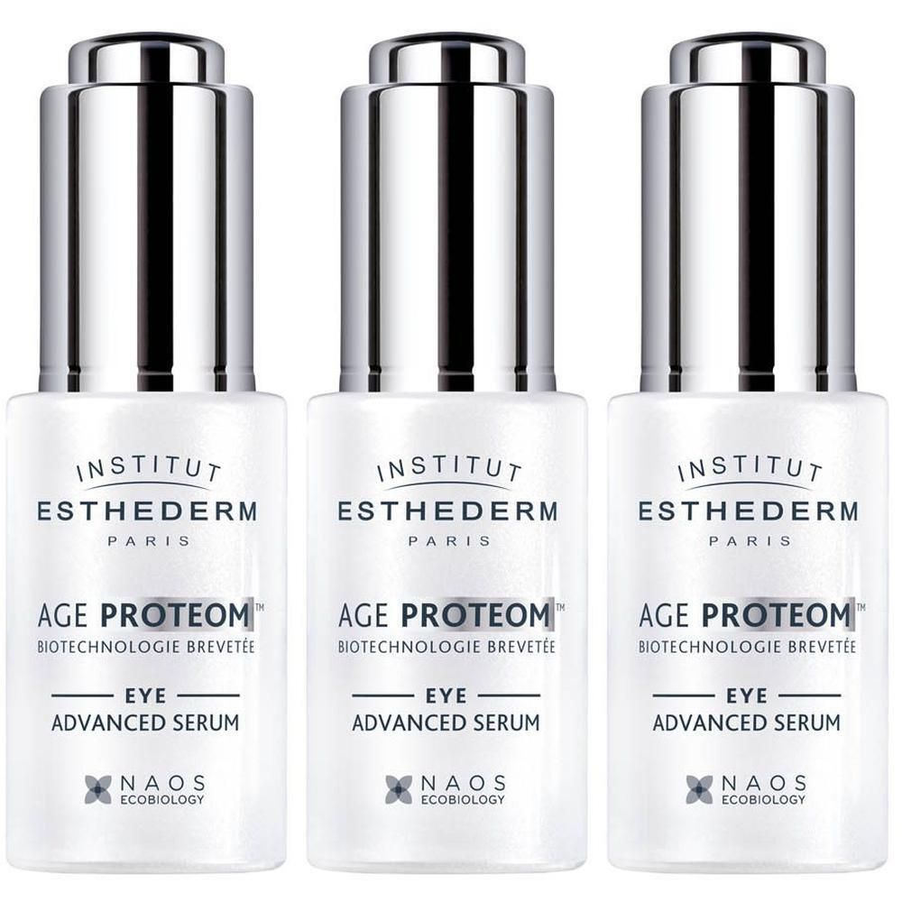 Drie flacons Age Proteom Sérum yeux. Witte flacons met zilveren doppen. Tekst: INSTITUT ESTHEDERM PARIS, AGE PROTEOM, EYE ADVANCED SERUM.