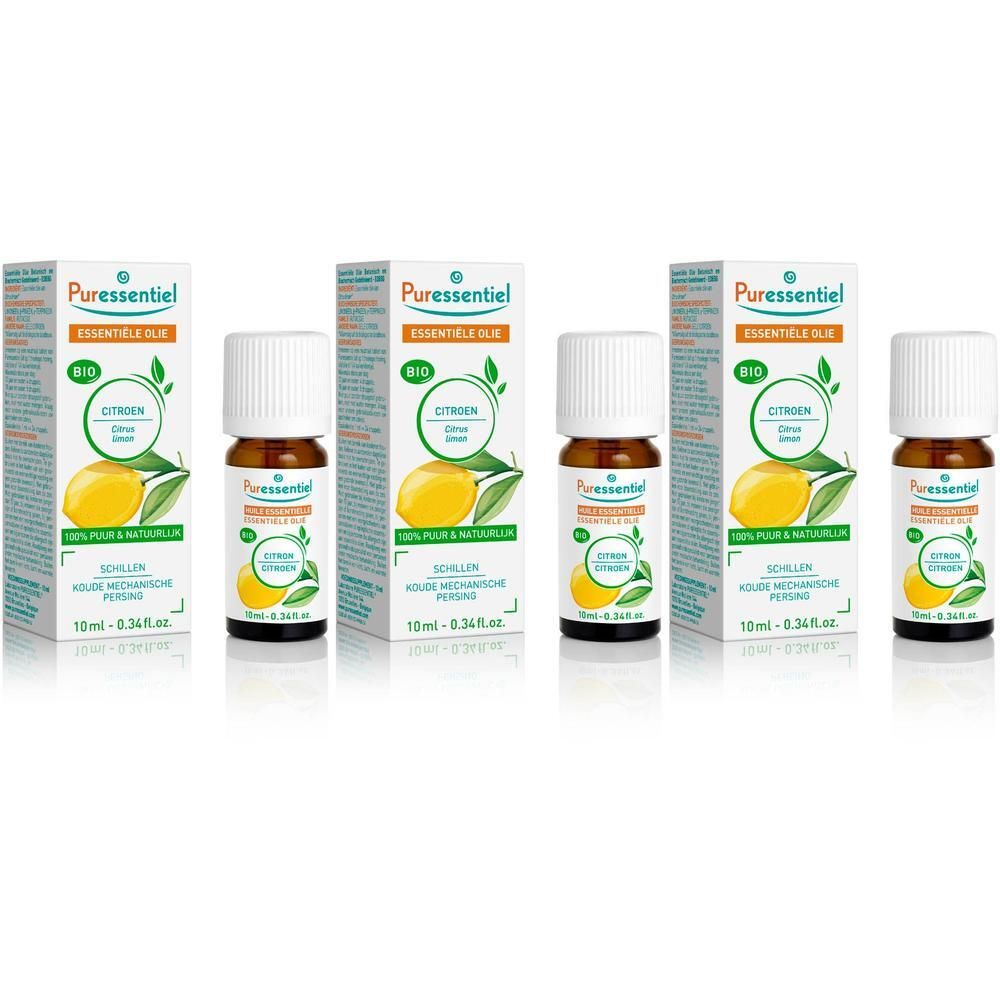 Plusieurs flacons et emballages d'huile essentielle. Sur les emballages, on lit "Citron" et "Bio". Les flacons sont bruns avec des bouchons blancs.