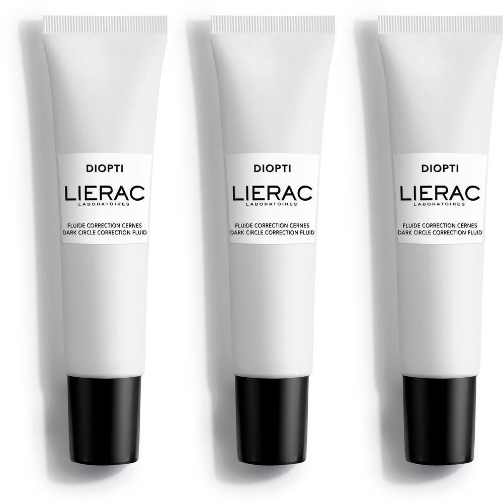 Trois tubes blancs avec bouchons noirs. Inscription "DIOPTI", "LIERAC", et "FLUIDE CORRECTION CERNES" sur chaque tube.