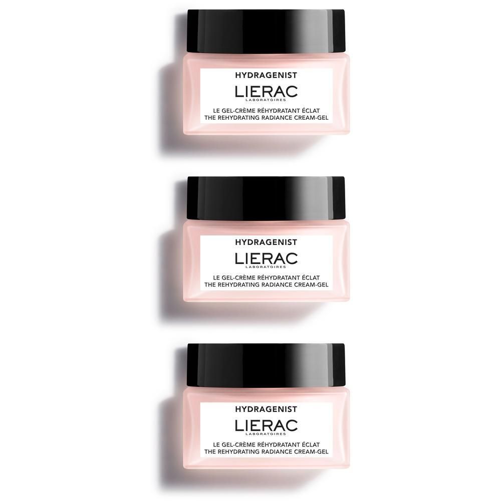 Trois pots avec couvercles noirs et étiquettes roses. Inscription: HYDRAGENIST, LIERAC, LE GEL-CRÈME RÉHYDRATANT ÉCLAT, THE REHYDRATING RADIANCE CREAM-GEL.
