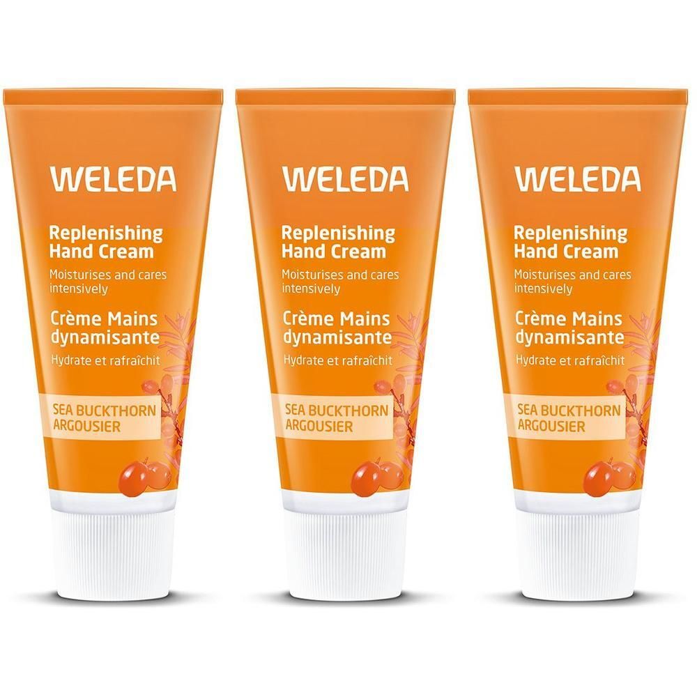 Trois tubes de crème pour les mains Weleda. Tubes orange avec bouchon blanc. Texte: Replenishing Hand Cream, Crème Mains dynamisante.