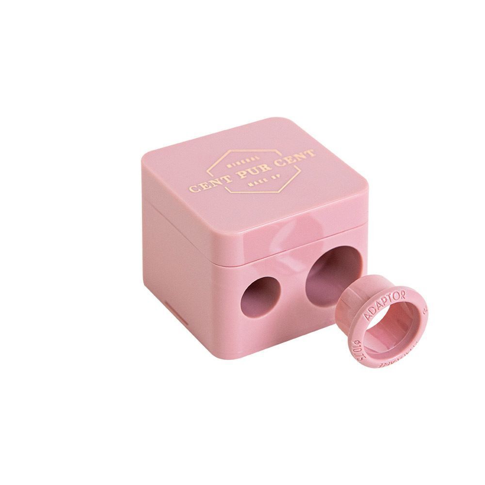 Roze puntenslijper met losse adapter. Vierkante vorm, twee gaten. Opschrift: Cent Pur Cent.