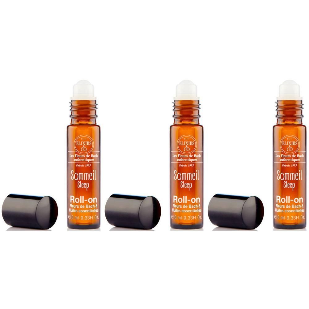 Trois flacons roll-on avec bouchon noir. Inscription: Sommeil Sleep Roll-on. Flacons en verre brun avec applicateur roll-on blanc.
