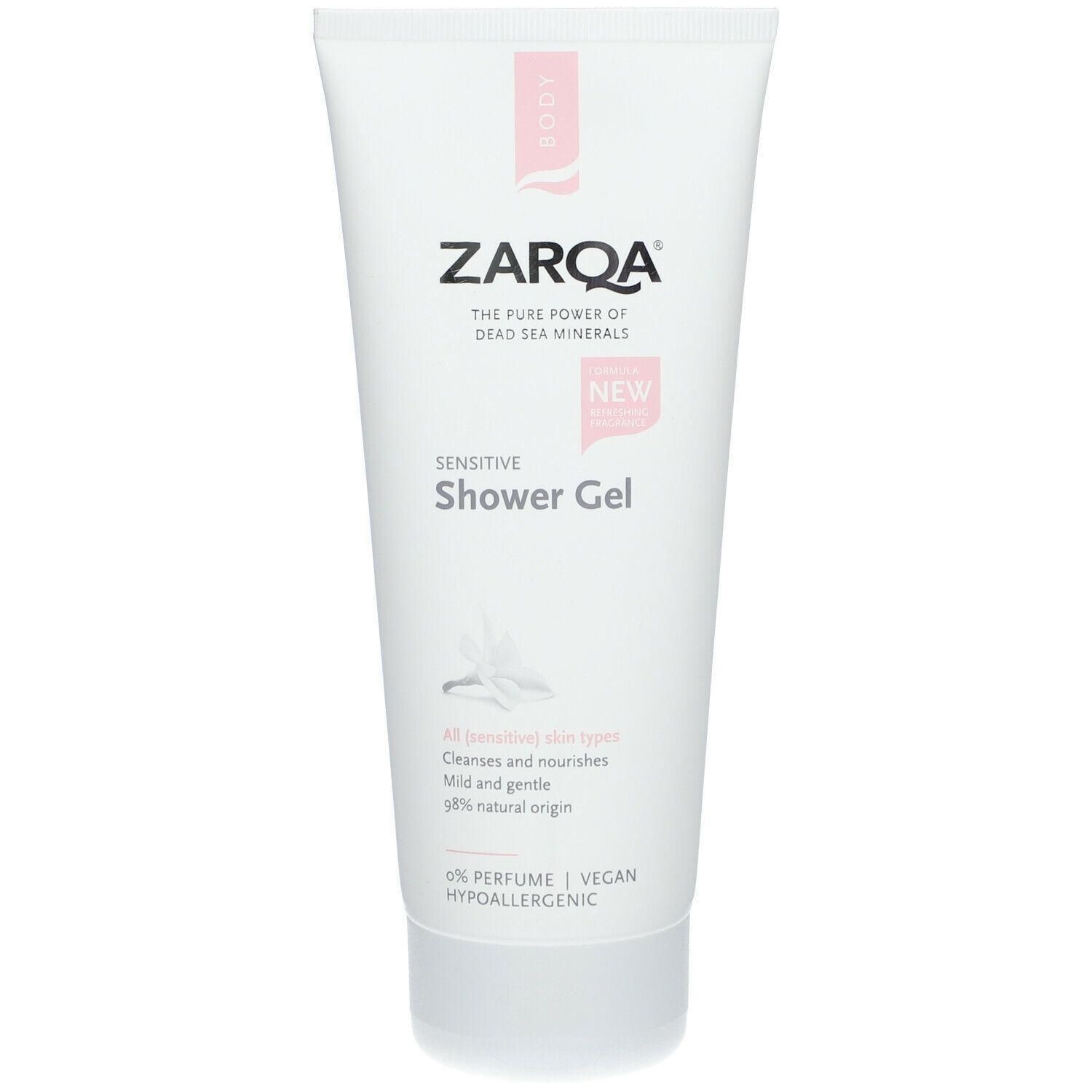 Tube blanc avec détails roses. Inscription: ZARQA, Sensitive Shower Gel. Informations sur les ingrédients et certifications.
