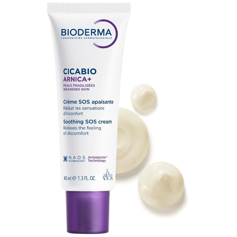Un tube de crème avec des gouttes de crème. Blanc, bouchon violet. Inscription: Bioderma, Cicabio Arnica+, Crème SOS apaisante, Soothing SOS cream.