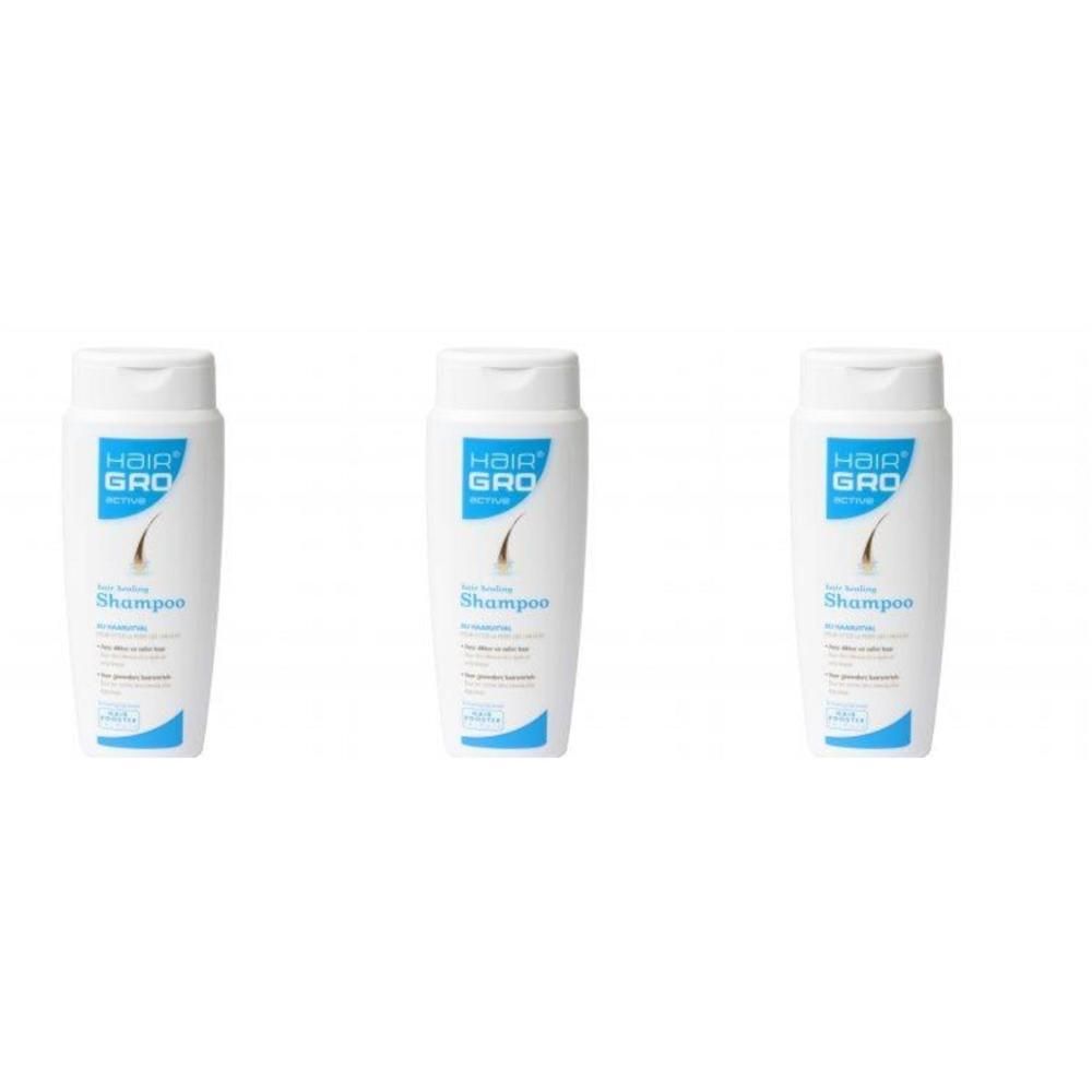 Trois flacons de shampooing blancs avec étiquette bleue. Inscription : HairGro, Shampooing.