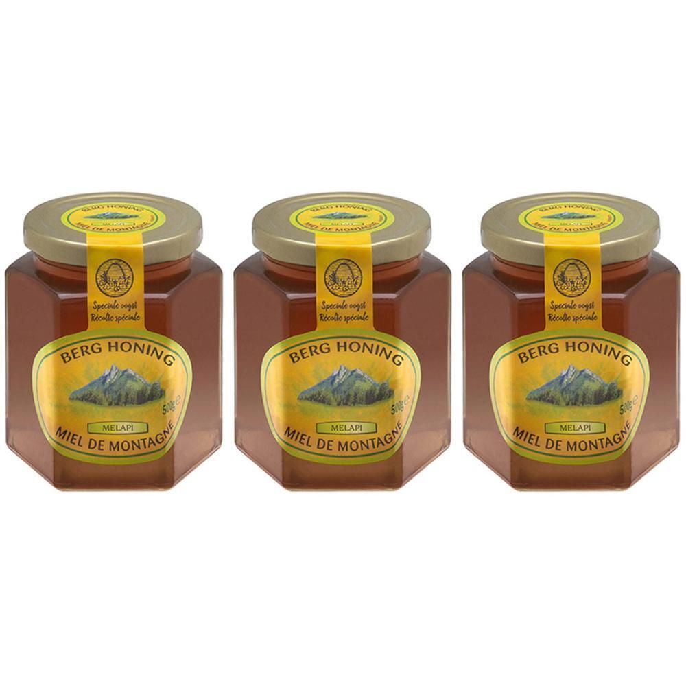 Drie potten honing. Labels: Berg Honing, Miel de Montagne. Gouden deksels en etiketten.