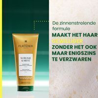 Gouden tube met haarverzorgingsproduct, merk René Furterer, "Sublime Karité" op het etiket.