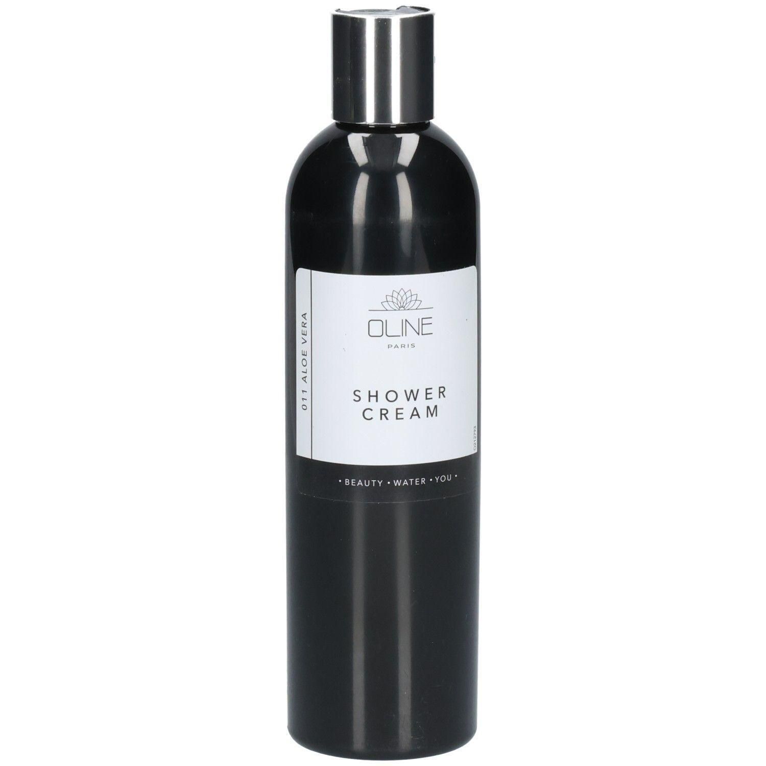 Flacon noir avec bouchon argenté. L'étiquette indique "Oline Paris Shower Cream".