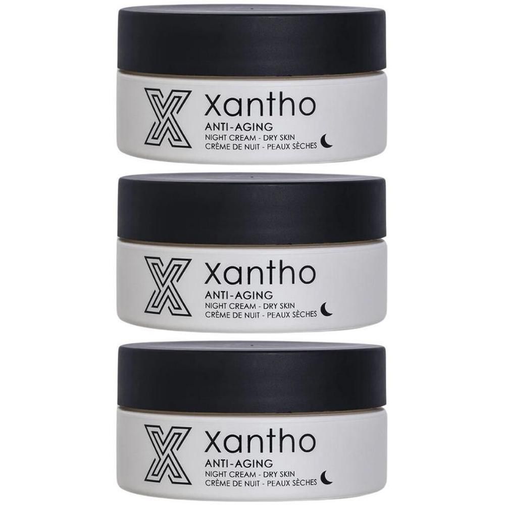 Drie potten Xantho anti-aging nachtcrème voor de droge huid. Zwart deksel, witte pot, productnaam en maansymbool.