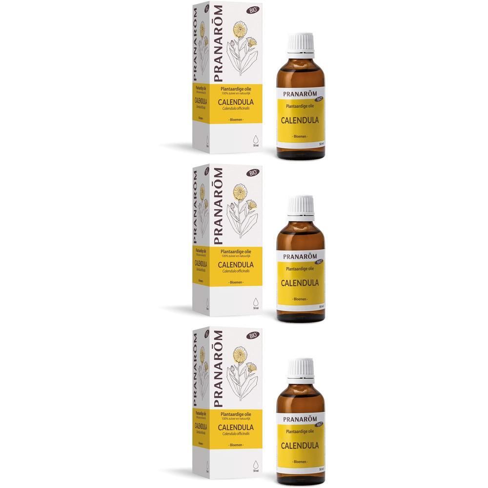 Drie flessen Calendula-olie met verpakking. Opschrift: Pranarôm, Calendula.