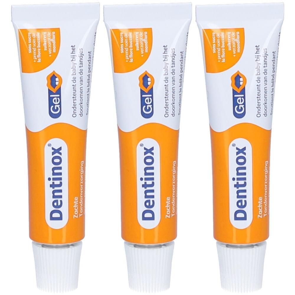 Trois tubes de gel Dentinox. Tubes blancs avec partie centrale orange. Inscription : Dentinox, Gel, soutient la poussée dentaire.