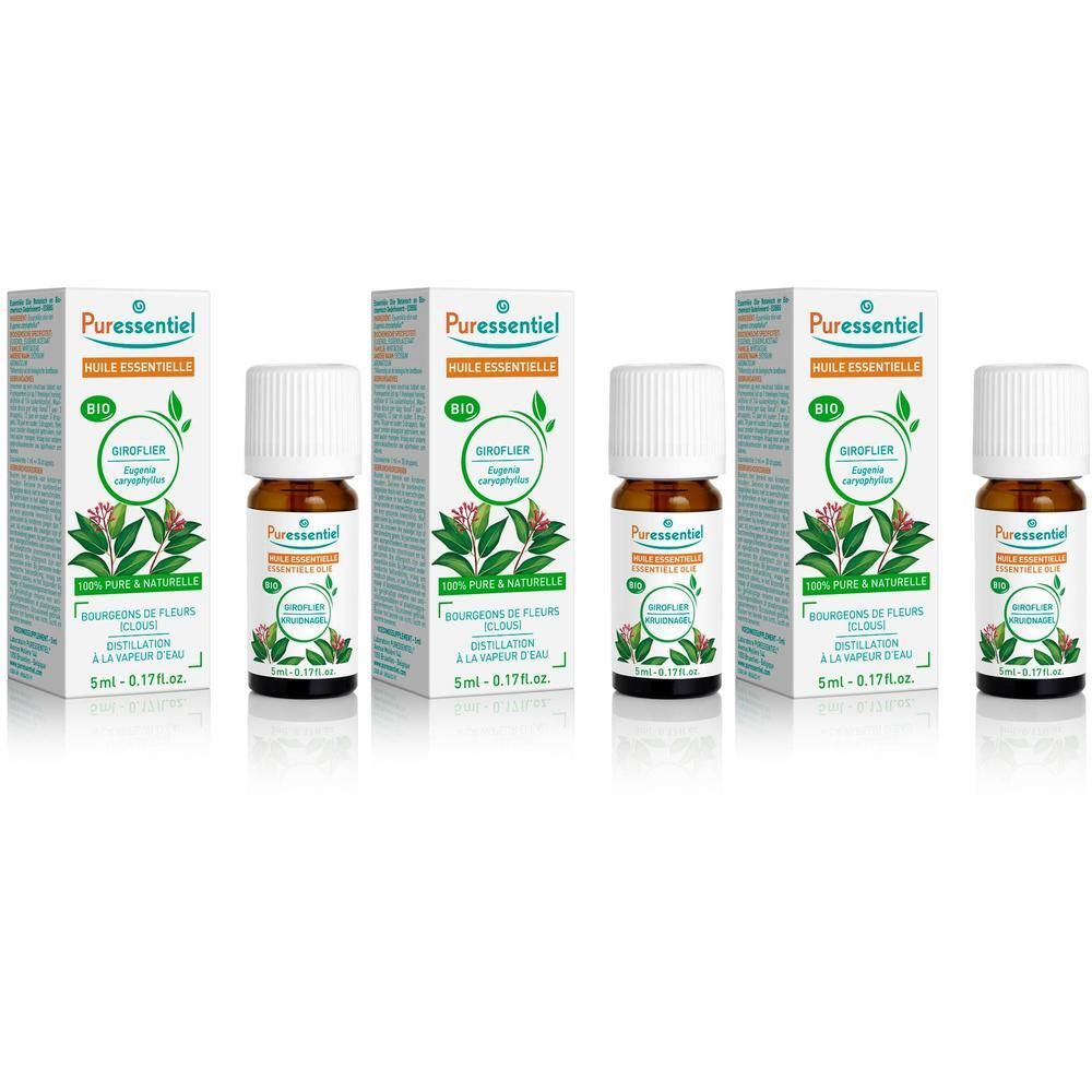 Plusieurs flacons et emballages de Puressentiel Giroflier Huile Essentielle Bio. Flacons à bouchon blanc, verre brun, dans des boîtes blanches.