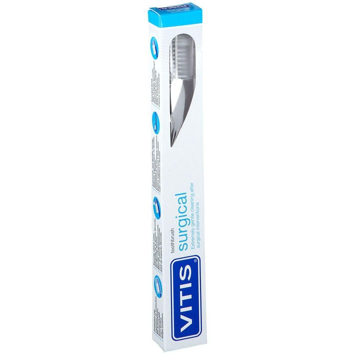 Tandenborstel in verpakking. Witte steel, grijze borstelharen. Verpakking met blauwe accenten en VITIS-logo.