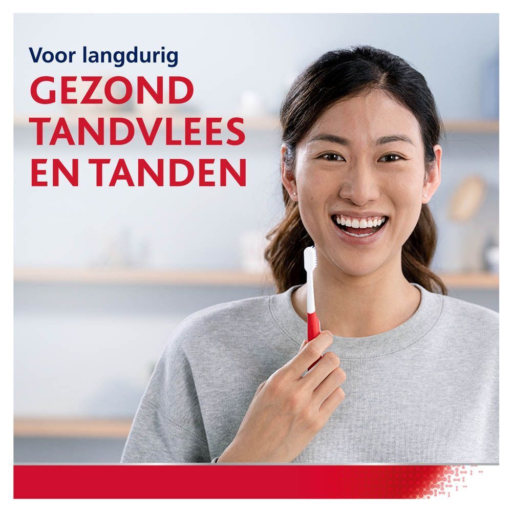 Vrouw met tandenborstel. Tekst: Voor langdurig gezond tandvlees en tanden.