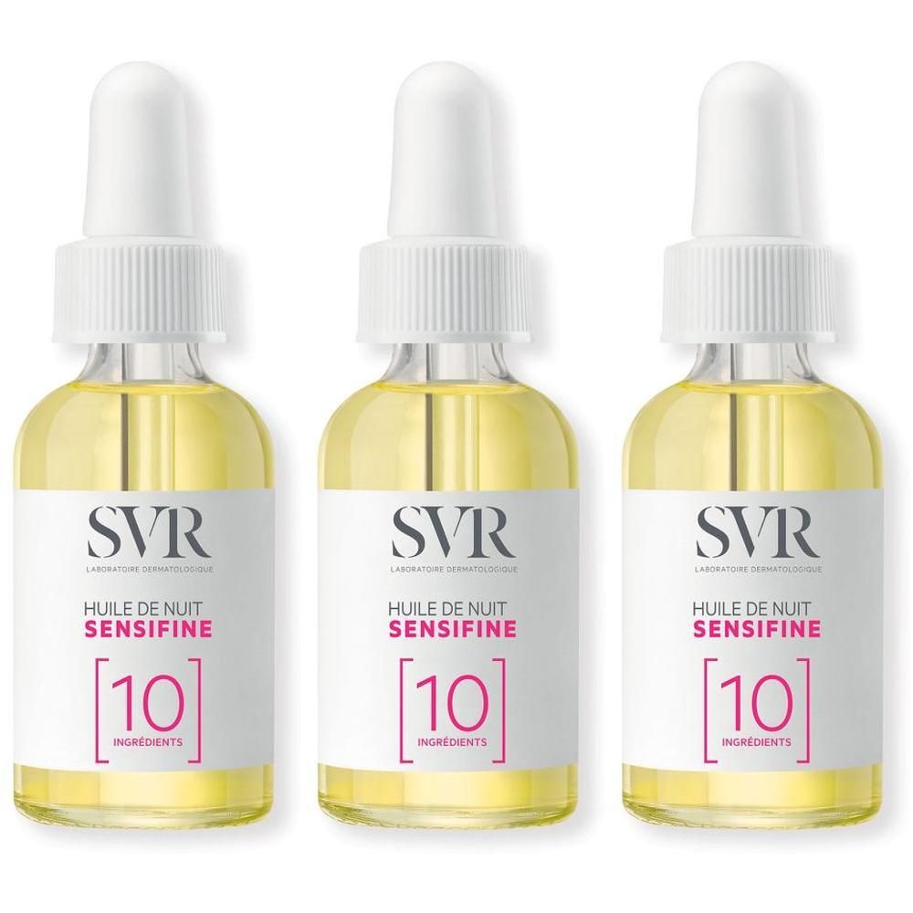 Trois flacons SVR Sensifine [10] Huile de Nuit. Flacons en verre transparent avec bouchon blanc et étiquette. Liquide jaune visible.