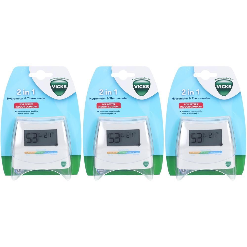 Trois thermomètres-hygromètres Vicks emballés individuellement. Chaque appareil affiche la température et l'humidité. L'écran affiche 53 et 21.
